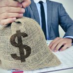 Generational Shifts in Wealth Transfer: Insights on Estate Planning and Intergenerational Sharing Person holding burlap sack with dollar sign.