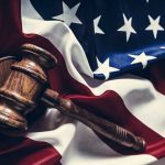 Trump Challenges Conviction in Manhattan Case Over Stormy Daniels Payment Gavel resting on the American flag.