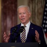 Lawmakers Target Biden Admin Over Border Failures Man speaking at podium with microphones indoors