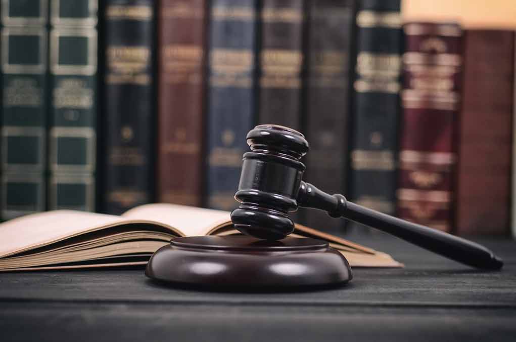 1686878860 featured image Gavel and open book in library setting