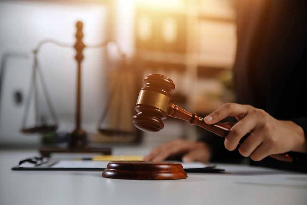 2478909667 featured image Gavel being struck near scales of justice.