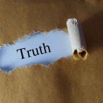 Biden’s Death Allegedly Planned by Allies, Book Reveals Ripped paper reveals word truth underneath brown surface