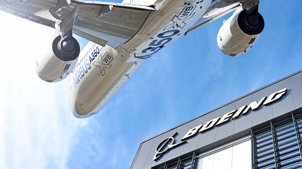1521947072 featured image Airbus plane flying over Boeing building