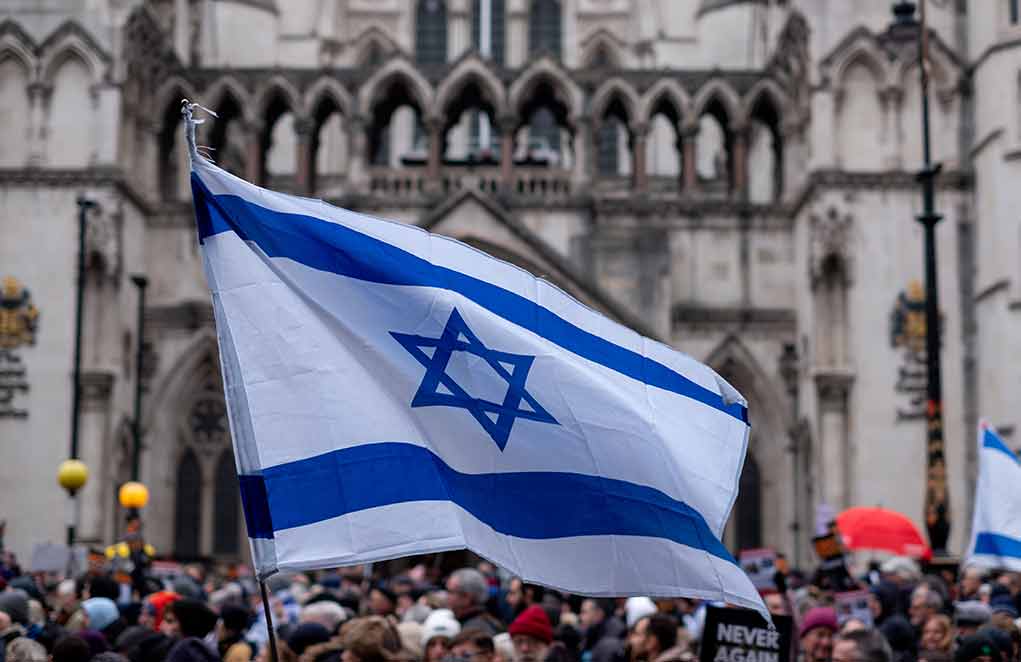 2393485591 featured image Israeli flag at a crowded outdoor event