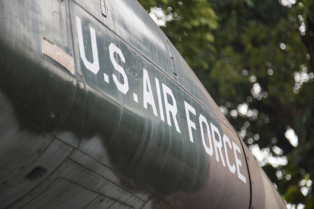 624049181 featured image U.S. Air Force plane with trees in background.