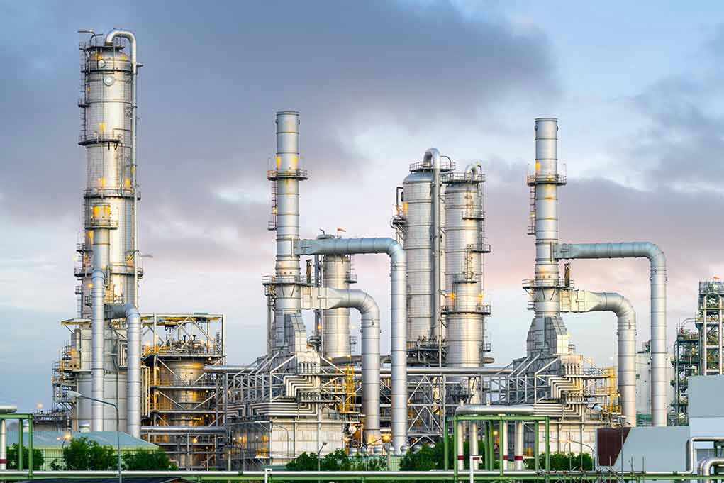 1892669737 Industrial plant with metal towers and pipes