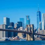 Staggering 400% ICE Surge: NYC’s Defiant Stand Brooklyn Bridge with Manhattan skyline in the background.