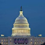 Government SHUTDOWN—Neither Side Budging U.S. Capitol building illuminated at dusk.