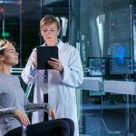 Woman undergoing brain scan with doctor monitoring results