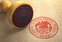 Fed Reserve CUTS Rates – Shock Vote Divides Federal Reserve stamp and wooden stamp on paper