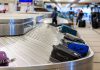 Further Shutdown CHAOS: Major U.S Airports Go Dark! Luggage on airport baggage claim conveyor belt.