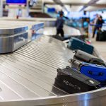 Further Shutdown CHAOS: Major U.S Airports Go Dark! Luggage on airport baggage claim conveyor belt.