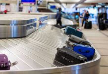 Further Shutdown CHAOS: Major U.S Airports Go Dark! Luggage on airport baggage claim conveyor belt.