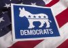 Senate SCANDAL – Candidates Bizarre Coverup EXPOSED! Democrats logo on American flag background