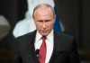 Putin’s Tsunami Weapon STUNS Pentagon – Wow! Person speaking into a microphone, official setting.