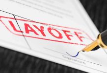 Paramount’s $8.4B Deal Triggers Shock Layoffs Close-up of a layoff notice with a signature line and a fountain pen