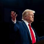 Trump Issues WAR DECLARATION – Armed Conflict! A man in a suit gesturing during a speech