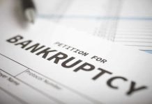 BANKRUPTCY FILED—Tech Giant on the Brink Petition for bankruptcy document with pen.
