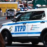 Mamdani’s New Safety Chief HATES Cops NYPD police car on a city street scene.