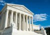 Trump PETITIONS SCOTUS – Legal Gamble Building with columns under a blue sky.