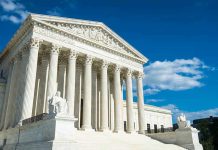 Trump PETITIONS SCOTUS – Legal Gamble Building with columns under a blue sky.