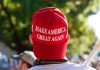 MAGA Revolt Explodes – Trump’s Base Turns Person wearing a red Make America Great Again hat.