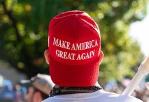 Person wearing a red Make America Great Again hat.