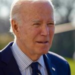 Biden Issues CHILLING Trump Warning—Democracy in Peril? Elderly man in suit outside in daylight.