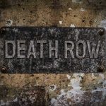 Execution Halted—Governor’s Move Shocks State Weathered Death Row sign on aged concrete wall