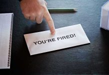 Verizon SLASHES 15,000 Jobs — Telecom Giant CRUMBLES Envelope with YOURE FIRED! and pointing finger.