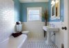 Modern bathroom with blue walls and white fixtures