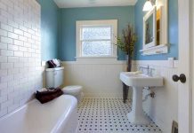 Modern bathroom with blue walls and white fixtures