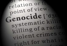 SHOCKING Civilian Massacre — 300 Dead Overnight Close-up of the word 'Genocide' in a dictionary with its definition