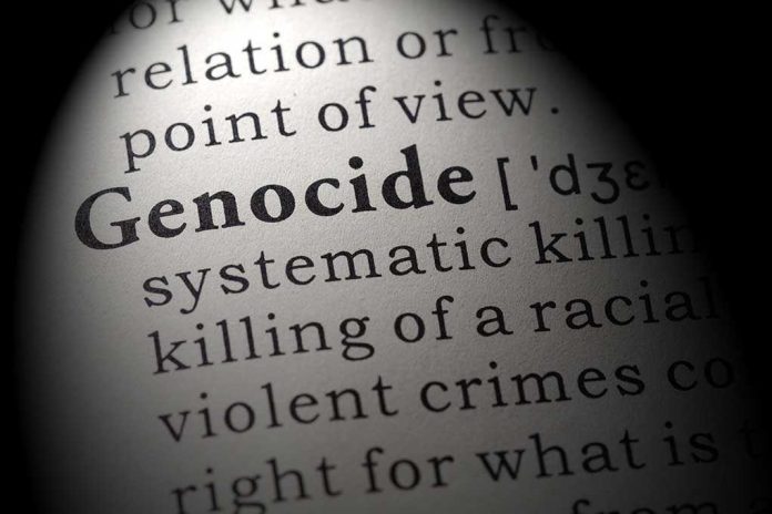 Close-up of the word 'Genocide' in a dictionary with its definition