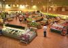 Grocery Giants Flee Socialist City: What’s Behind It? Interior of a grocery store filled with fresh produce and shoppers