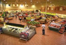 Grocery Giants Flee Socialist City: What’s Behind It? Interior of a grocery store filled with fresh produce and shoppers