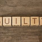 Porn Star BEHEADS Partner – Withdraws Plea! Wooden blocks arranged to spell 'GUILTY' on a wooden surface