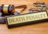 Billionaire Demands Public Executions RETURN Gavel, handcuffs, and Death Penalty sign on desk.