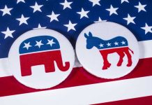 Dem Donors BETRAYED – Candidate Ditches Party Right Before Election Republican elephant and Democrat donkey on American flag.