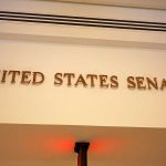 Dem Senator INVESTIGATED – Massive Fraud Allegations Sign displaying United States Senate in a government building