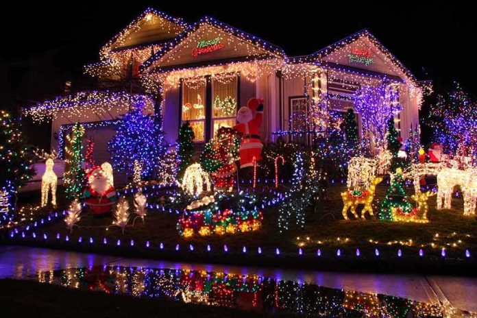 A house decorated with colorful Christmas lights and festive figures