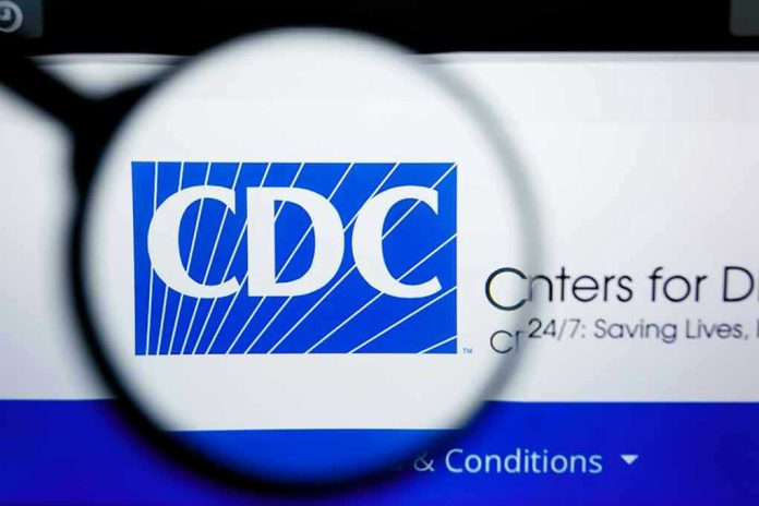 1450445633 CDC logo magnified on a screen.