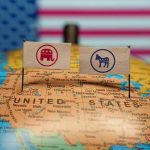 Trump FREEZES $10 Billion From Liberal States Republican and Democratic flags on USA map background.