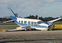Pilot Killed in Fiery Plane Crash at Private Airport Damaged blue and white small airplane on an airport runway
