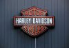 Harley-Davidson Motor Cycles logo on dark wall.