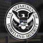 Schumer Lists ONE Demand to Reopen DHS U.S. Department of Homeland Security emblem on wall.