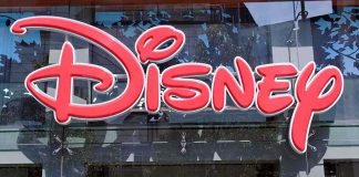 Bright red Disney logo displayed on a storefront window
