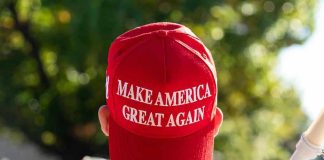 Person wearing a red Make America Great Again hat.