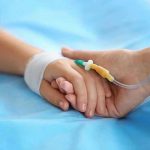 Toddler Tragedy – Father’s INEXCUSABLE Neglect! Two hands holding, one with medical IV attached.