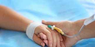 Toddler Tragedy – Father’s INEXCUSABLE Neglect! Two hands holding, one with medical IV attached.